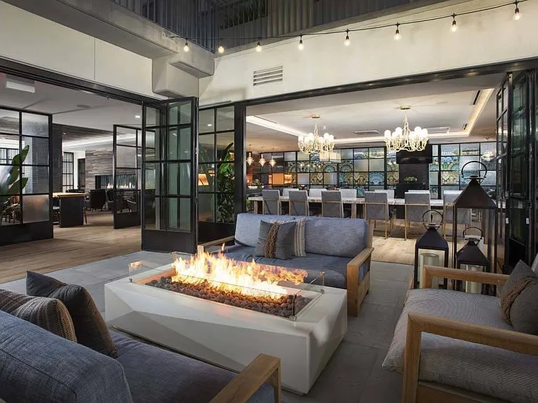 Gather around the fire table in the outdoor lounge area