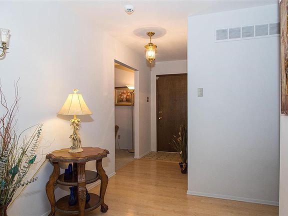 A spacious entry foyer that grants access to the living room or the family room.