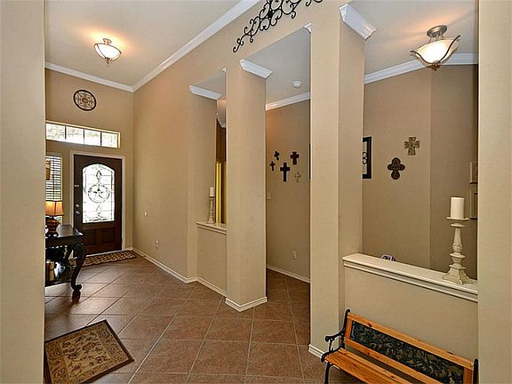 Ultra high ceilings, crown molding, and display ledges