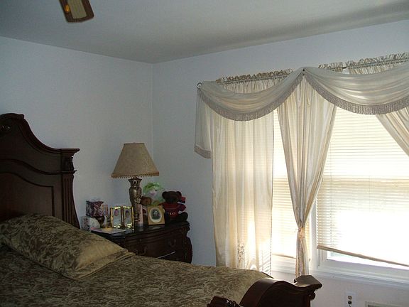 masterbed room with walk in closet and regular closet