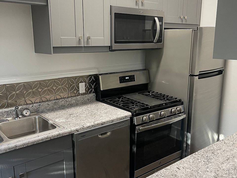Brand new galley kitchen with eat in space at counter
