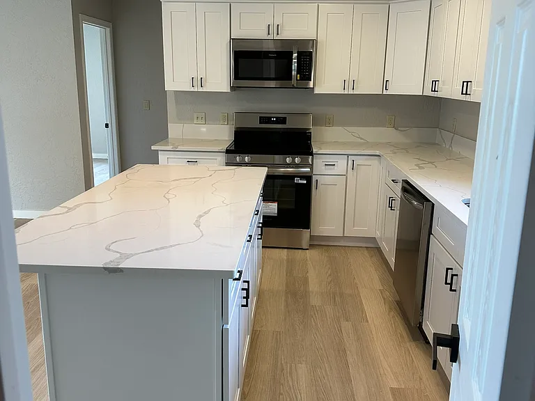 spacious kitchen island with storage and walkway