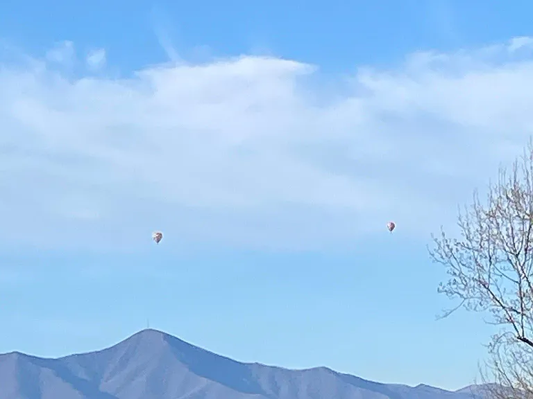 View of Mt Pisgah and hot air ballons from front porch.