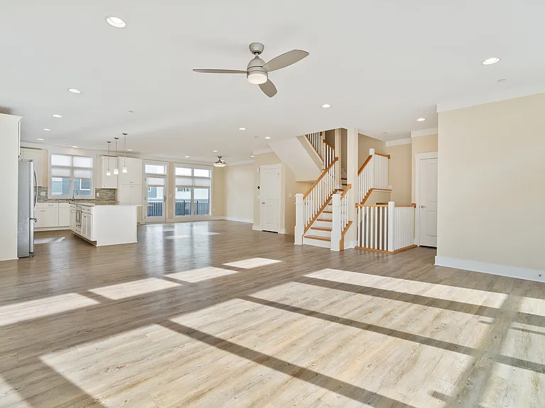 living area looking into kitchen and dining area