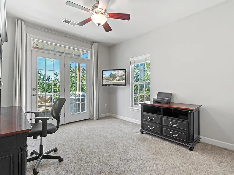 2nd bedroom with French doors leading to deck