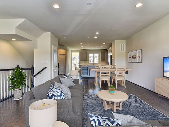 Cafe Open to Upgraded Kitchen with Gray Cabinetry