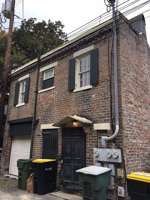 Entrance to Carriage House from East Jones Lane, Lane is Well Lit at Night. View is of South side of carriage house.