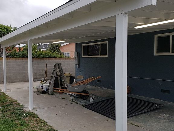 Large covered patio with lighting for entertaining __