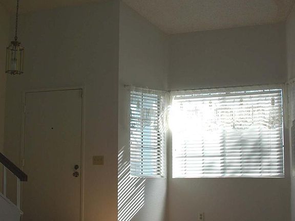 Living Room / Front Door / Stairs at Left up to all Bedrooms.