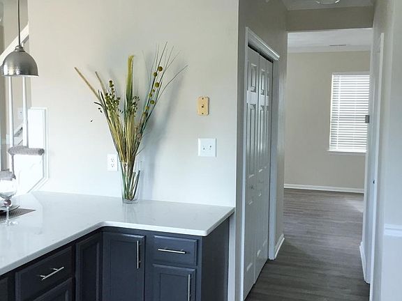 View of Hall (w/ Bath & Laundry) to Den