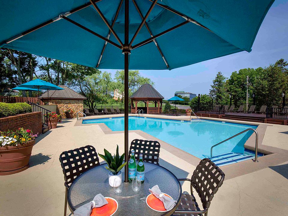 Resort-style pool with dining area