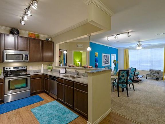 Eat In Kitchen with espresso cabinets and designer light kit