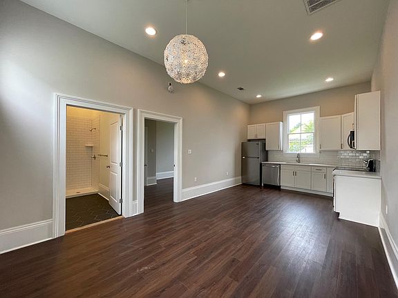 Living room looking into bath and bedroom