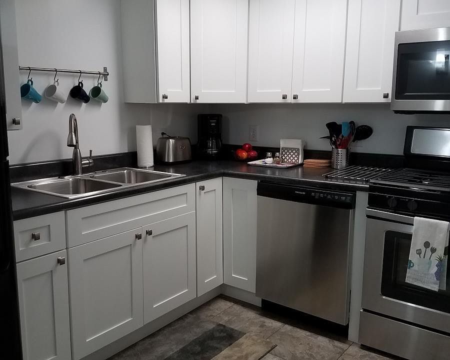Kitchen has gas range, dishwasher, microwave and refrigerato