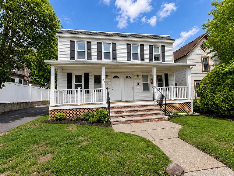 Charming Summit duplex-style home with covered front porch, fresh curb appeal, and off-street parking.