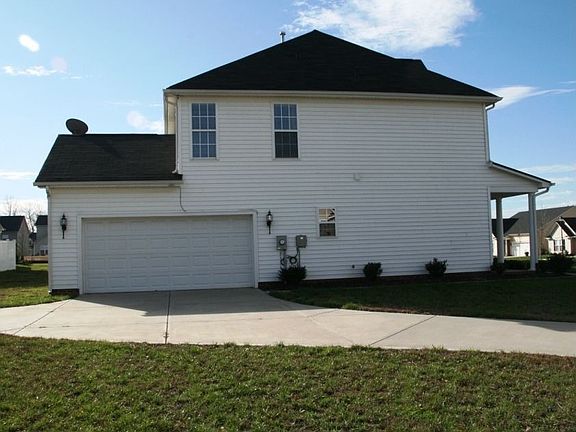 Corner lot w/side load 2 car garage + work area