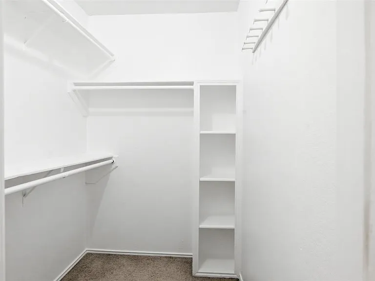 walk-in closet in primary bedroom