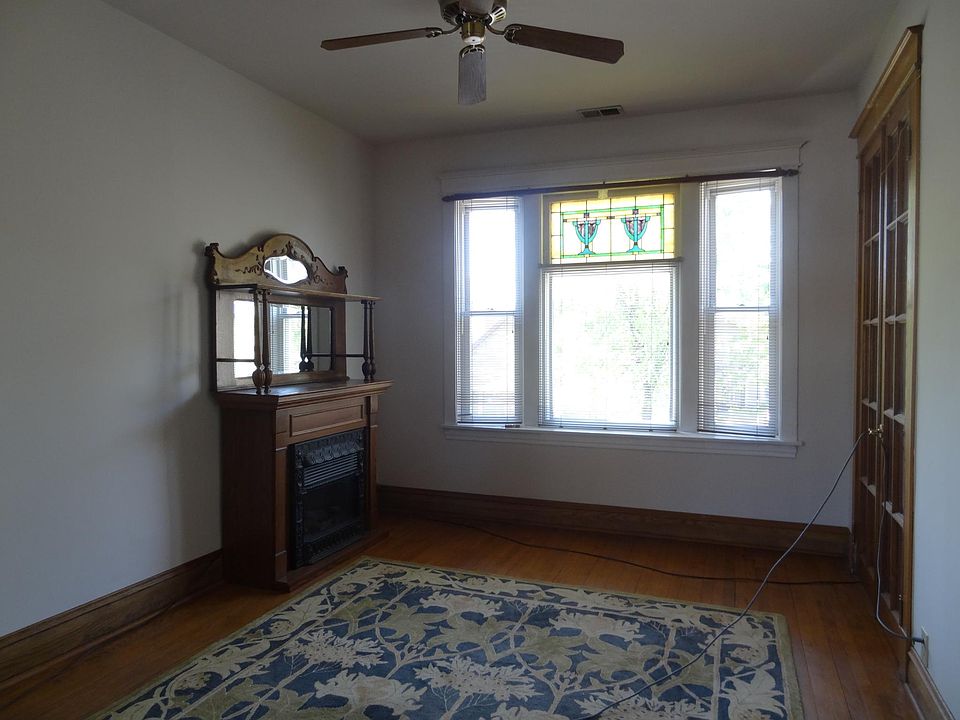 Stained glass and fireplace in living room