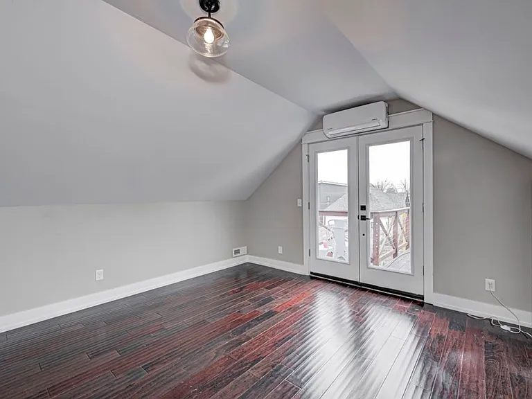 2nd Bedroom (Upstairs; very large; walkout to private roof deck above garage)