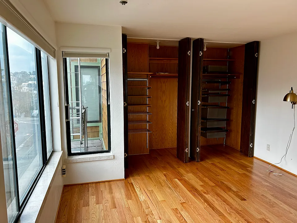 Closet organizers in bedroom closet