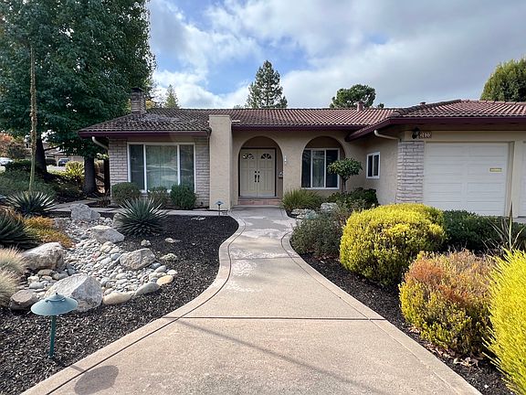 Front walkway and landscaped yard