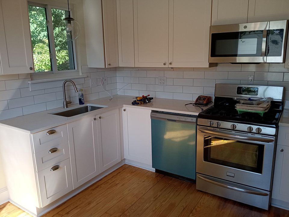 Renovated Kitchen. New dishwasher, new cabinets, new faucet, new microwave, new countertop