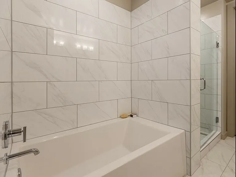 Soaking Tub and Separate Shower with Marble Style Tile (Oasis Floorplan)