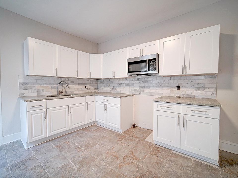 Kitchen includes a stove and fridge