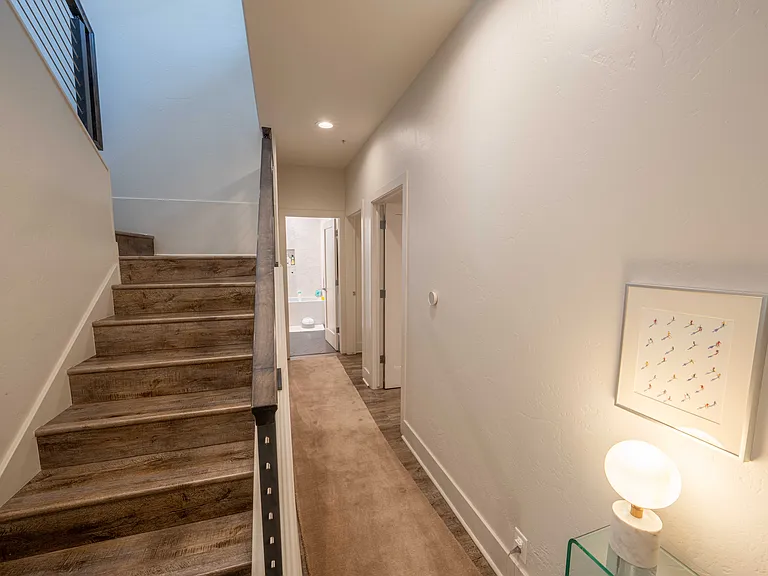 Two bedrooms and shared bathroom downstairs.