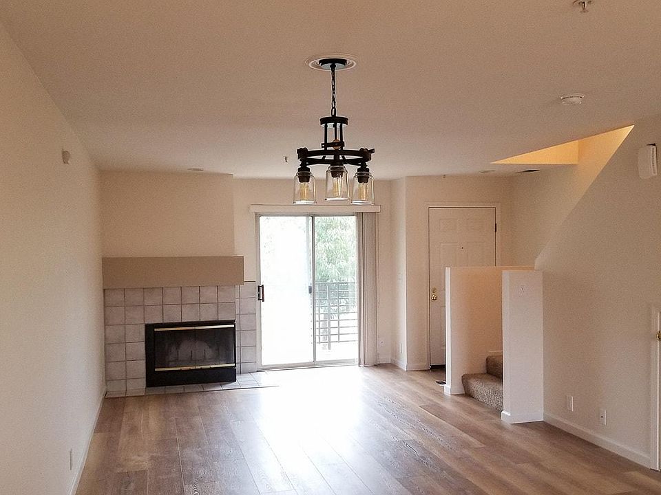 View from Kitchen to front door and door to patio.