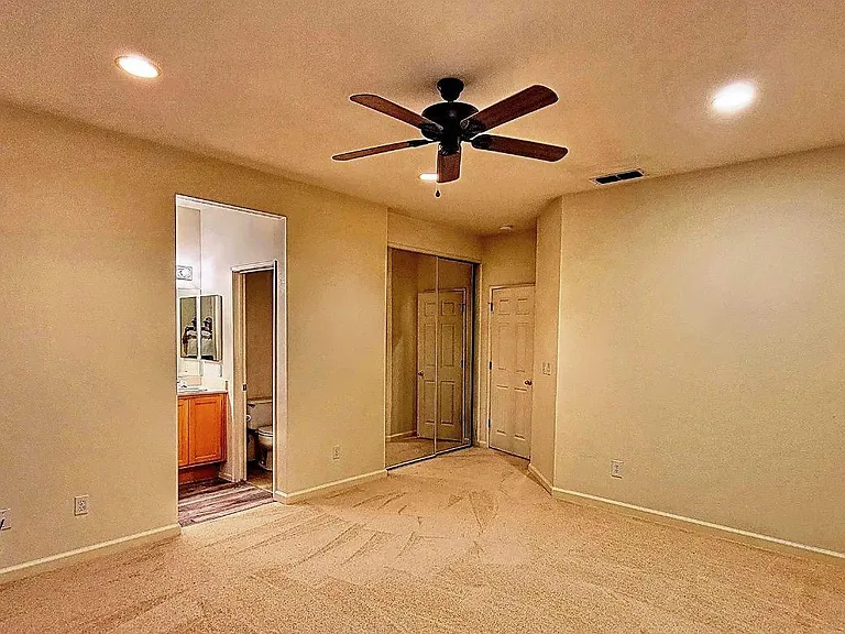 Small walk in closet inside the master's bedroom.
