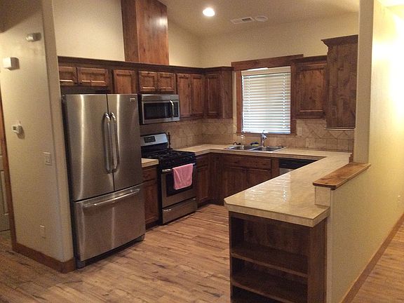 Kitchen with refrigerator