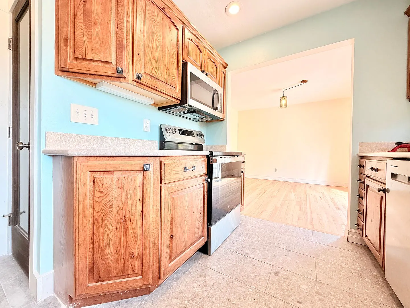 Charming Updated 1950s Home with Refinished Hardwoods & Large Fenced Yard Landscaping Included! — Photo 4