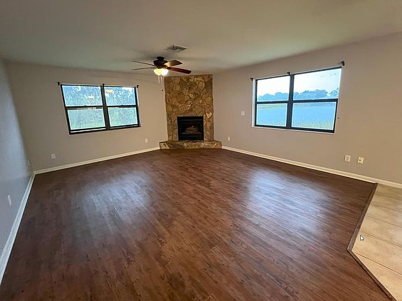Living room view from front door to gas fireplace