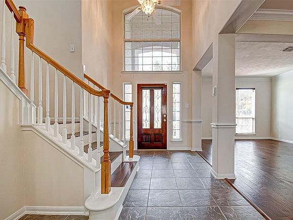 Formal, 2-story entry way with so much light