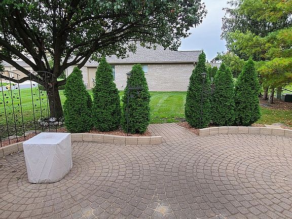 Large brick paver patio.