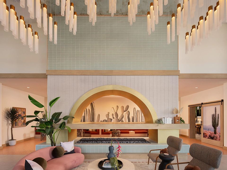 A statement lobby with desert tones, layered lighting, and inviting seating_welcome home to Modera Rio Salado.