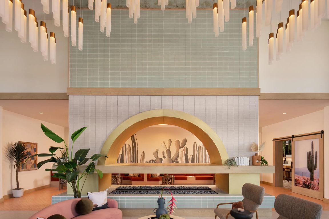 A statement lobby with desert tones, layered lighting, and inviting seating_welcome home to Modera Rio Salado.