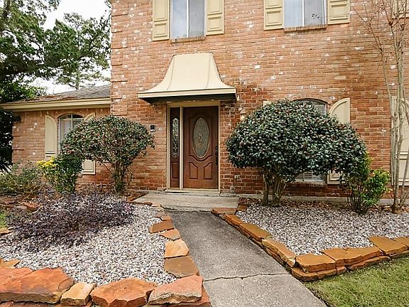 Beautiful rock landscaping welcomes you in.