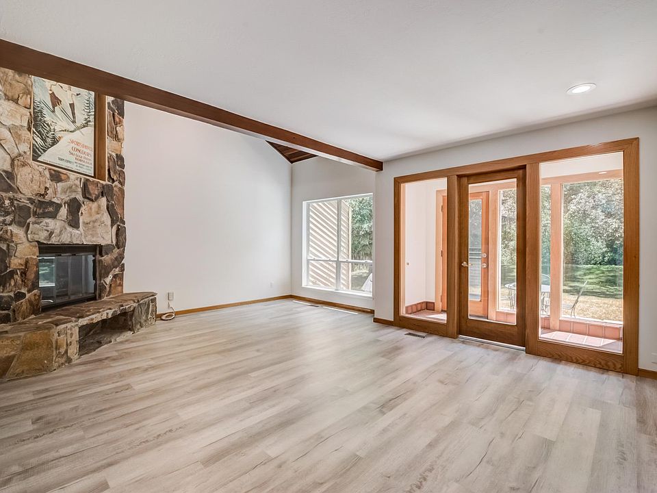 Great Room with Sun Room leading to the private, tree line backyard