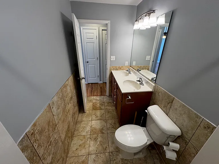 Beautiful bathroom with double sinks making getting ready in the morning easy for the whole family.