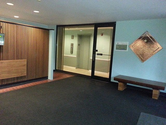 Building lobby with security access. Phone dial up for guest