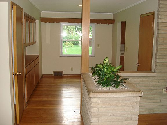 Entry - wood floors are in amazing condition with fantastic MCM details