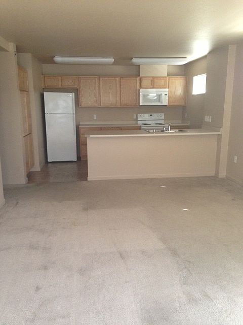 Spacious living room and bright kitchen