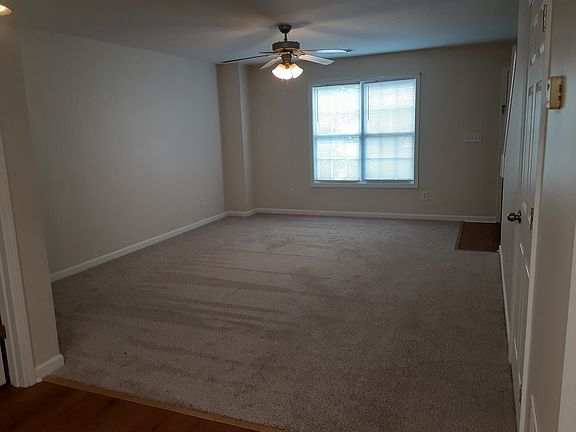 Family room as seen from the kitchen and dining area. New carpet.