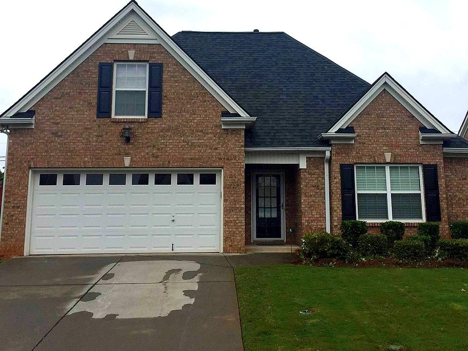 4 side brick, 2 car garage w/ master on main level