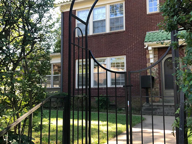 front yard with tall privet and gate for privacy