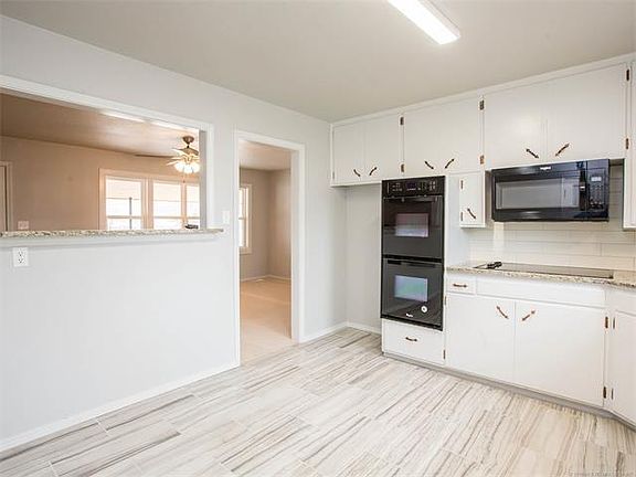 Kitchen includes refrigerator (not shown)