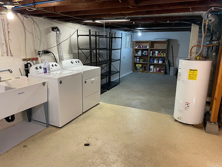 Large laundry and storage space in basement.