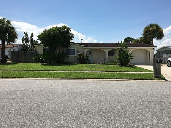Street view of house with lawn.